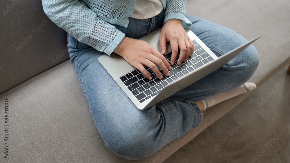 Fototapeta premium Close up hands typing keyboard on labtop. Businesswoman work during technology online connection business.