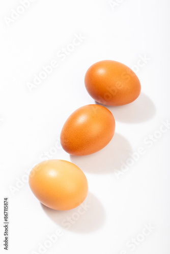 Brown eggs on a white background