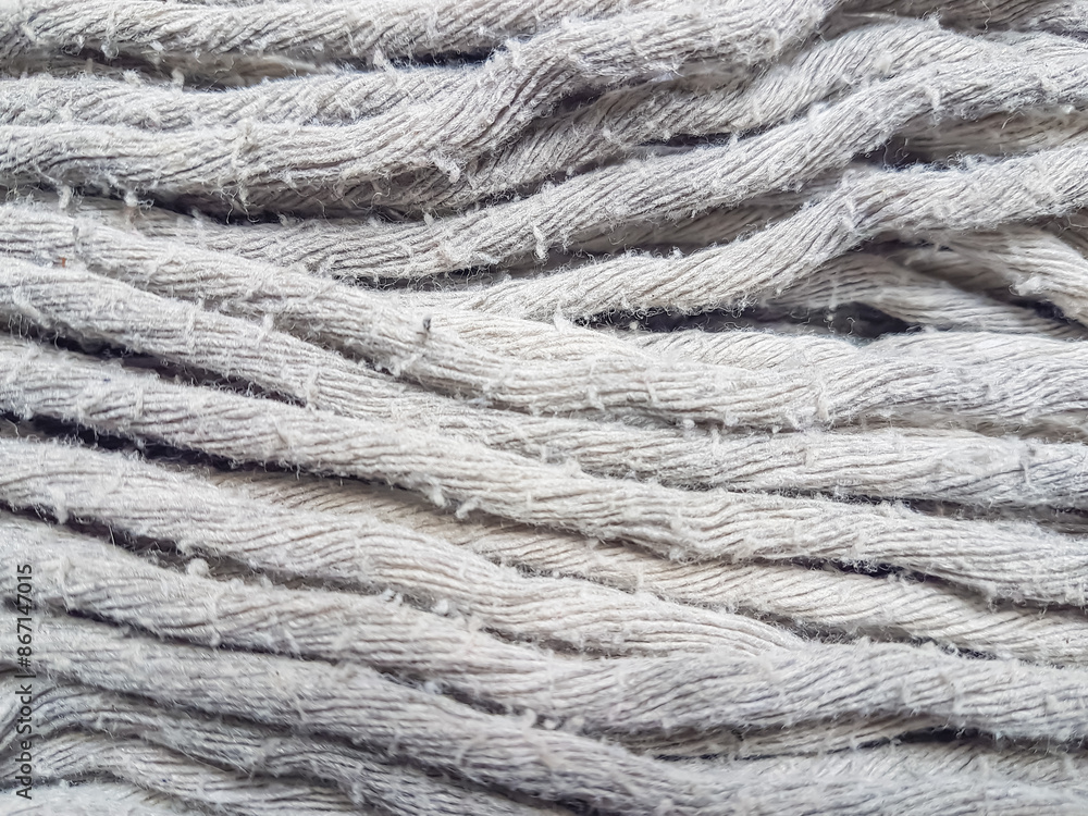 mop fibers made of cotton cloth. Mops that have been used, not new and dirty. Background and texture material. mop fibers made of cotton cloth. Mops that have been used, not new and dirty. Background and texture material.