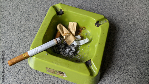 Close up of cigarette and cigarette ashtray. health concept. photo