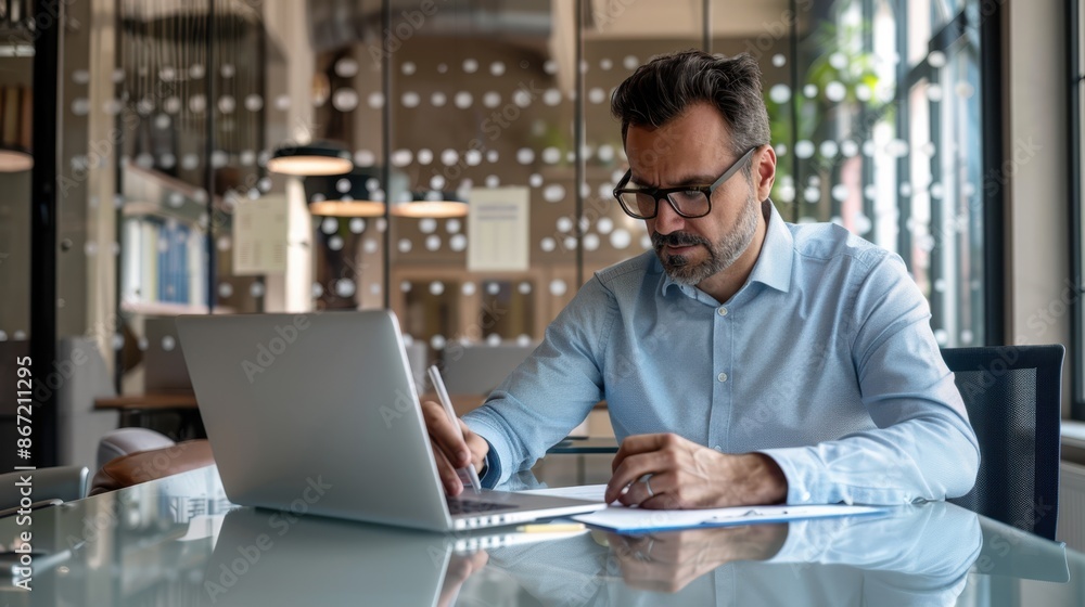 Fototapeta premium Man Working at Office Desk