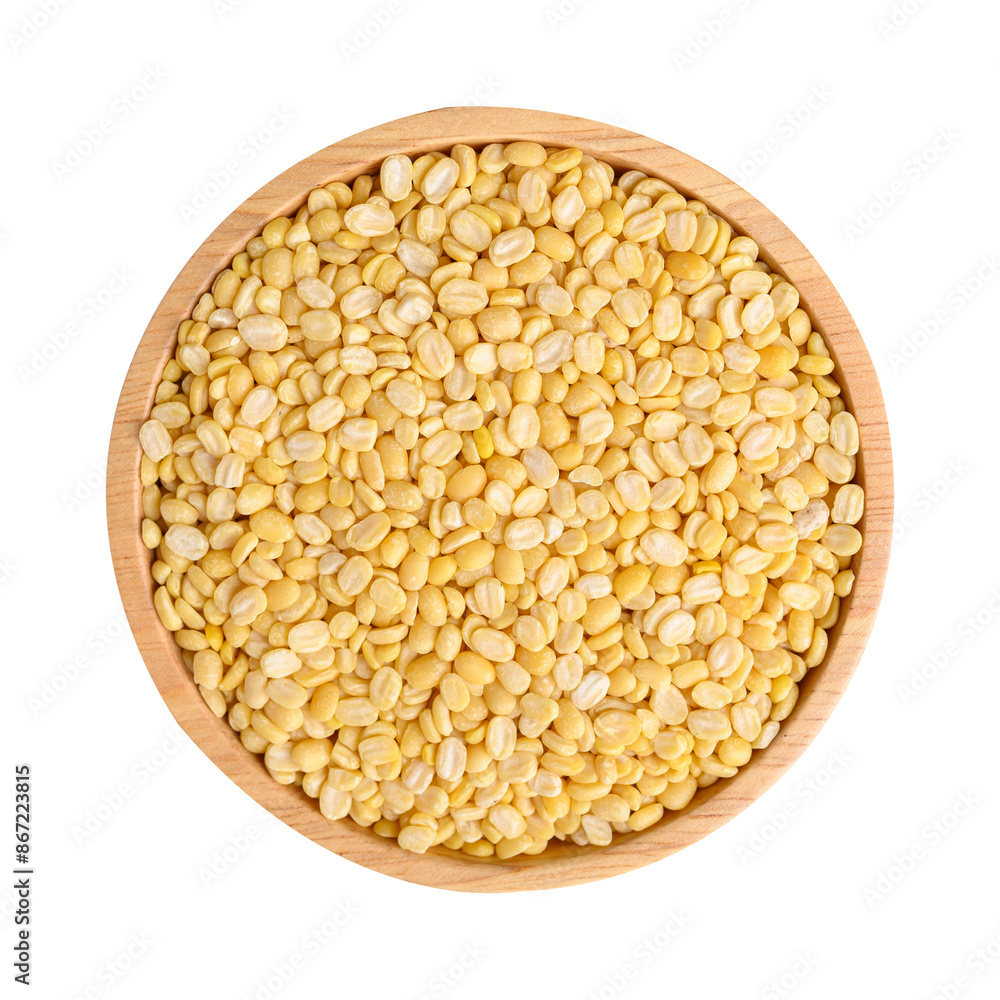 Yellow peeled split mung bean in wooden bowl, Top view Yellow peeled split mung bean in wooden bowl, Top view