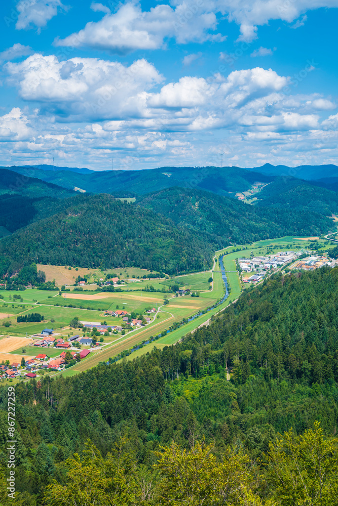 Germany, Aerial nature scenery view above black forest tree tops, mountains, valleys near haslach im kinzigtal, kinzig river flowing through the valley
