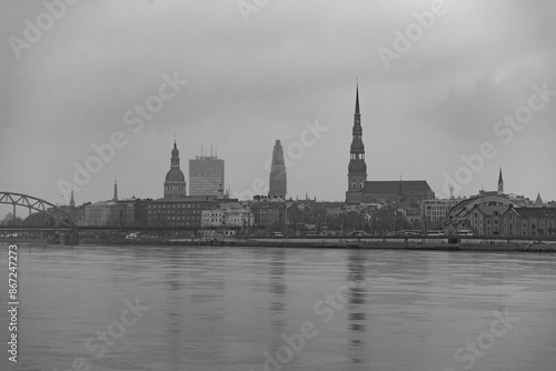 cloudy city with brigde over the river daugava