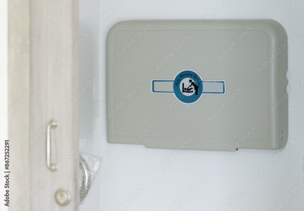 baby changing station in public toilet room for traveller. clean foldable diaper table. baby changing station in public toilet room for traveller. clean foldable diaper table.