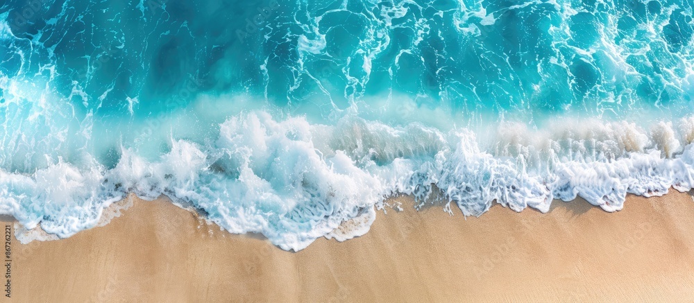 Panoramic view of a sandy beach with sea waves rolling on the shore. Aerial photography capturing the coast and ocean scenery with copy space available. Panoramic view of a sandy beach with sea waves rolling on the shore. Aerial photography capturing the coast and ocean scenery with copy space available.