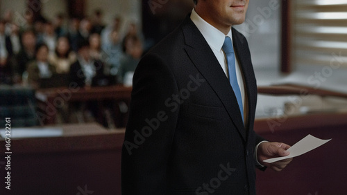 Lawyer hold paper evidence talking in a courtroom to speaking to jury or attorney in court