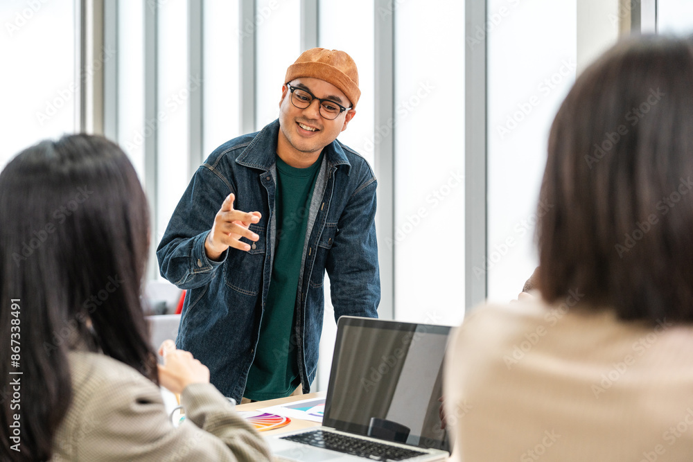 Fototapeta premium Asian business start up freelance people team analyzing statistics financial. Group Team of businesspeople man and woman Meeting Conference Discussion various topic Corporate Concept in office.