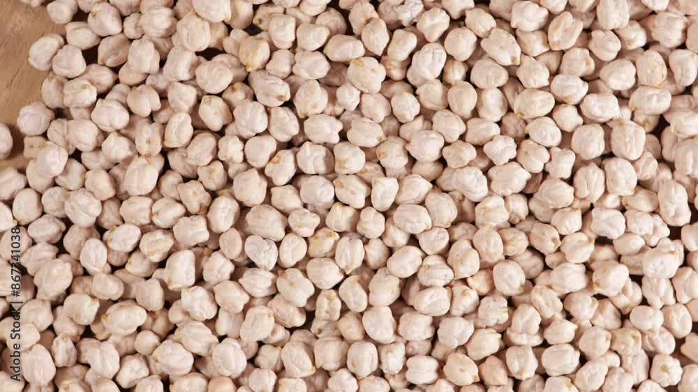 uncooked chick peas background food rotation uncooked chick peas background food rotation