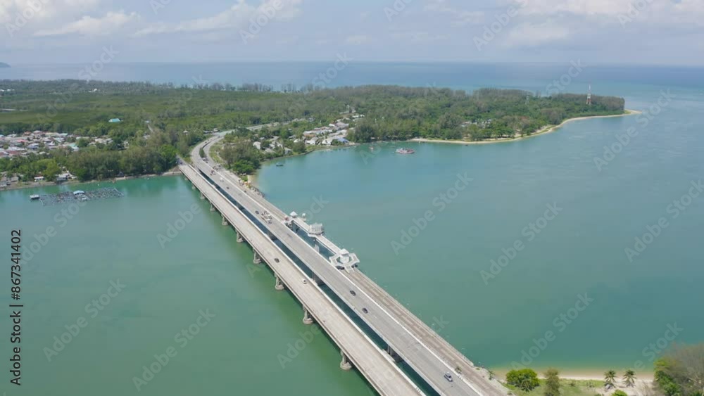 Aerial view of Sarasin Bridge with clear blue turquoise seawater, Andaman sea in Phuket island in summer season, Thailand. Water in ocean material pattern texture wallpaper background. Aerial view of Sarasin Bridge with clear blue turquoise seawater, Andaman sea in Phuket island in summer season, Thailand. Water in ocean material pattern texture wallpaper background.