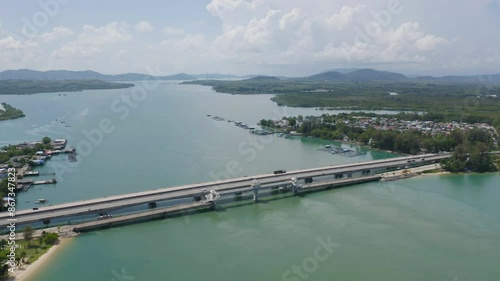 Aerial view of Sarasin Bridge with clear blue turquoise seawater, Andaman sea in Phuket island in summer season, Thailand. Water in ocean material pattern texture wallpaper background. photo