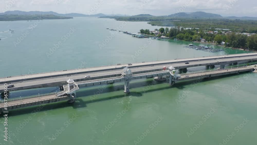 Aerial view of Sarasin Bridge with clear blue turquoise seawater, Andaman sea in Phuket island in summer season, Thailand. Water in ocean material pattern texture wallpaper background. Aerial view of Sarasin Bridge with clear blue turquoise seawater, Andaman sea in Phuket island in summer season, Thailand. Water in ocean material pattern texture wallpaper background.