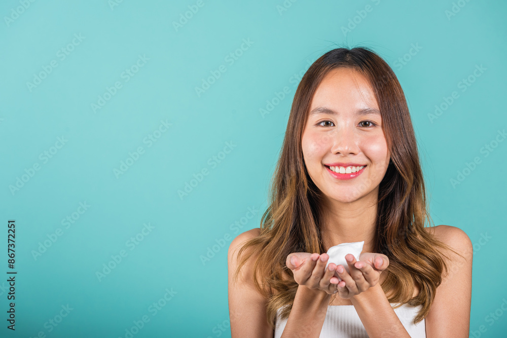 Portrait Asian young woman hands are adorned with white foam mousse studio shot isolated on blue background, beautiful female holding cleansing foam daily self care routine, beauty skincare concept Portrait Asian young woman hands are adorned with white foam mousse studio shot isolated on blue background, beautiful female holding cleansing foam daily self care routine, beauty skincare concept