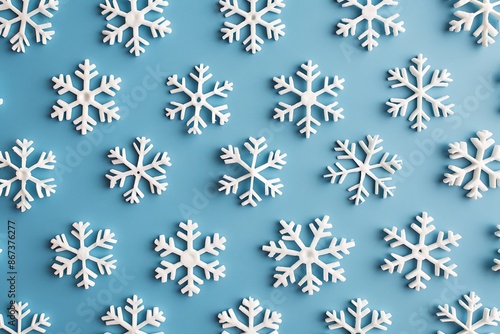 A pattern of minimalist, white snowflakes on a cool blue background