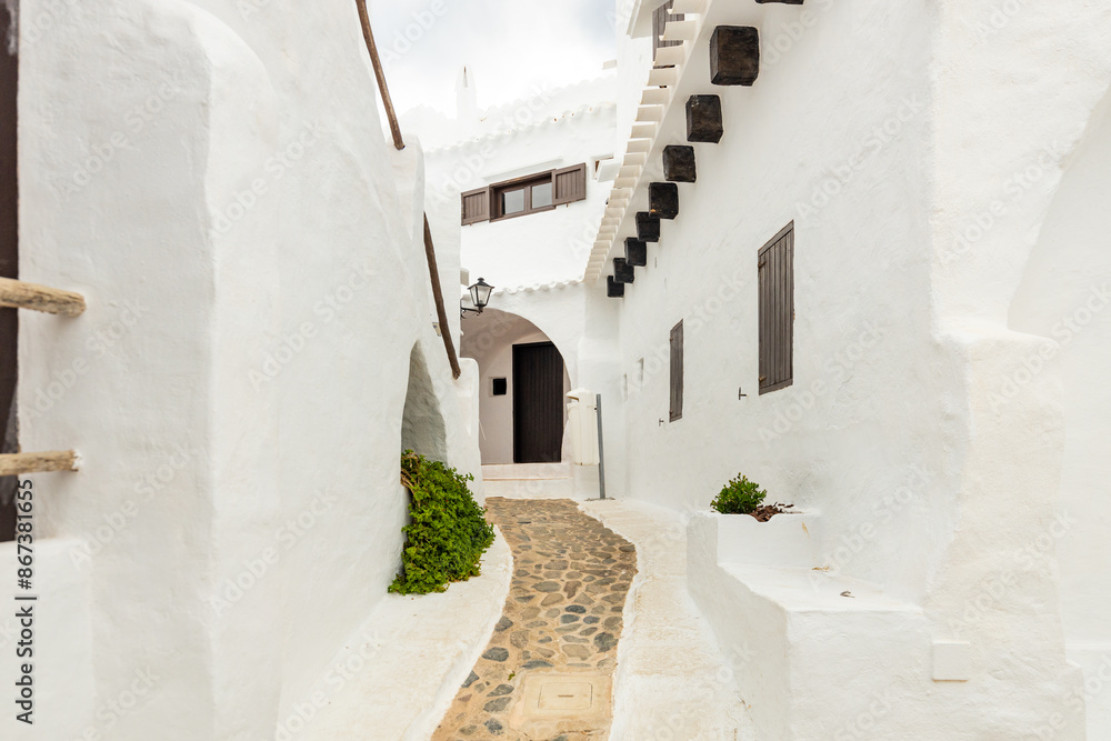 Obraz premium Menorca in Spain on the Balearic Islands, the quiet and picturesque village of Binibeca with white houses