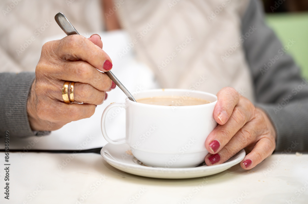 Close up of elderly woman enjoying breakfast. High quality photo Close up of elderly woman enjoying breakfast. High quality photo
