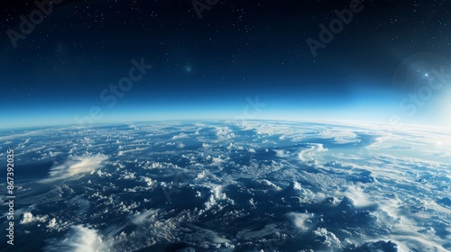 A photograph capturing the Earths atmosphere from near space, showcasing a vast expanse of clouds and the blue curvature of the planet