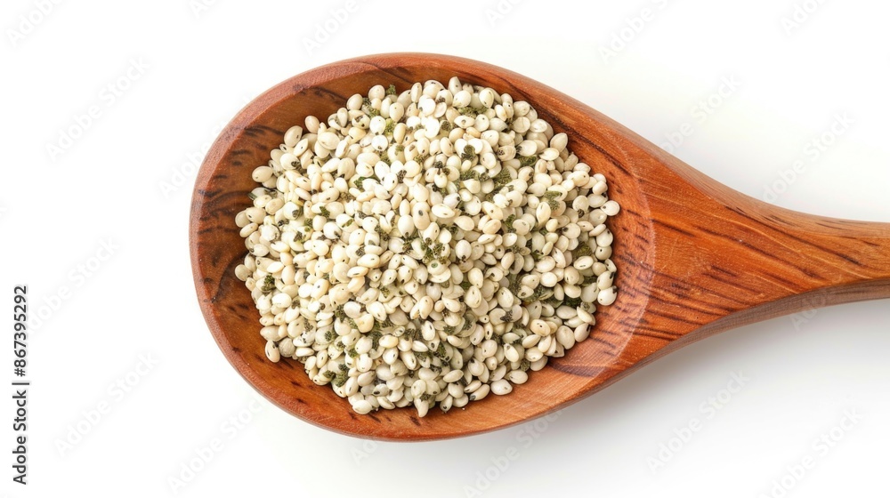 A wooden spoon filled with sesame seeds, great for cooking or baking A wooden spoon filled with sesame seeds, great for cooking or baking