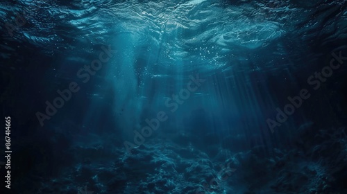 Deep blue ocean with sunlight shining through the water