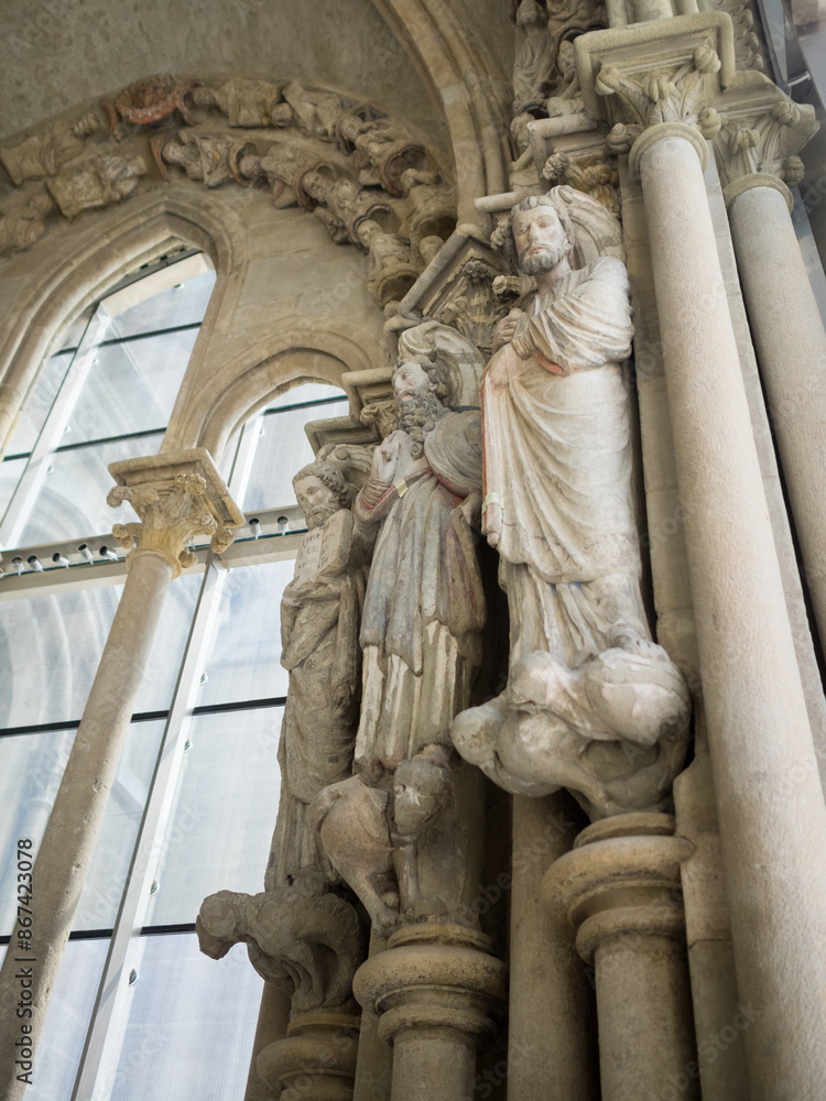 Fototapeta premium Painted statues from the south door of Lausanne Cathedral