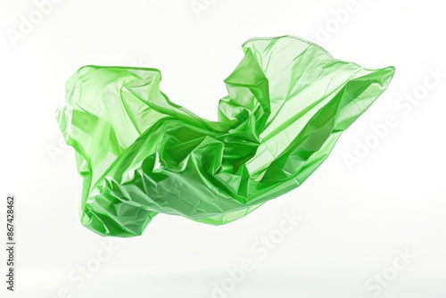 A green plastic bag suspended in mid-air, free from any visible restraints