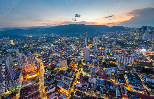 Sunset view of George Town and city lights from the top of Komtar Tower,Penang Island,Malaysia.