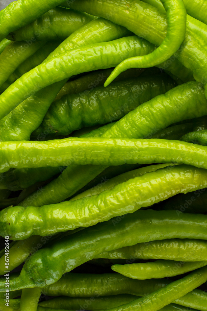 Hot green pepper in pods. Close, background. Hot green pepper in pods. Close, background.