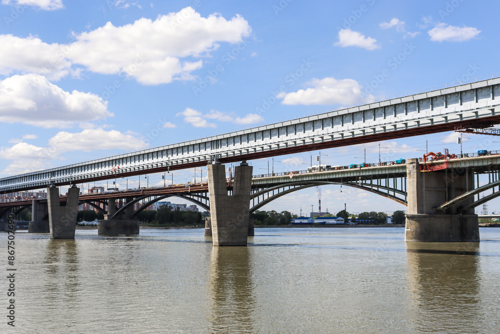 Novosibirsk, Novosibirsk region, Russian Federation - June 01 2024. Novosibirsk metro bridge and Oktyabrsky bridge Novosibirsk, Novosibirsk region, Russian Federation - June 01 2024. Novosibirsk metro bridge and Oktyabrsky bridge