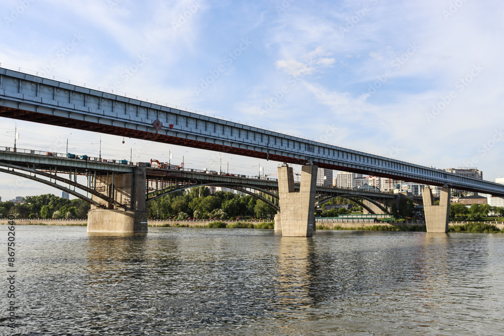 Naklejka premium Novosibirsk, Novosibirsk region, Russian Federation - June 01 2024. Novosibirsk metro bridge and Oktyabrsky bridge