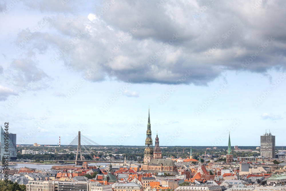 Fototapeta premium Picture of a panorama of the center of Riga. Riga is the capital city of Latvia and a major business hub of baltic states. This aerial panorama of Riga, Latvia, focuses on the historic district of Vec