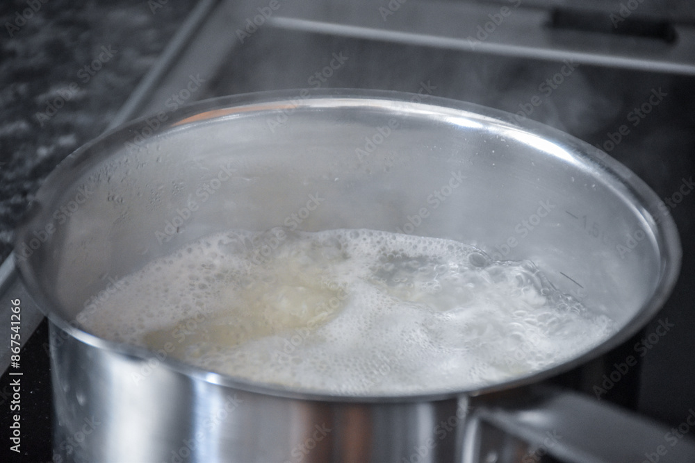 Cooking white rice in a saucepan Cooking white rice in a saucepan
