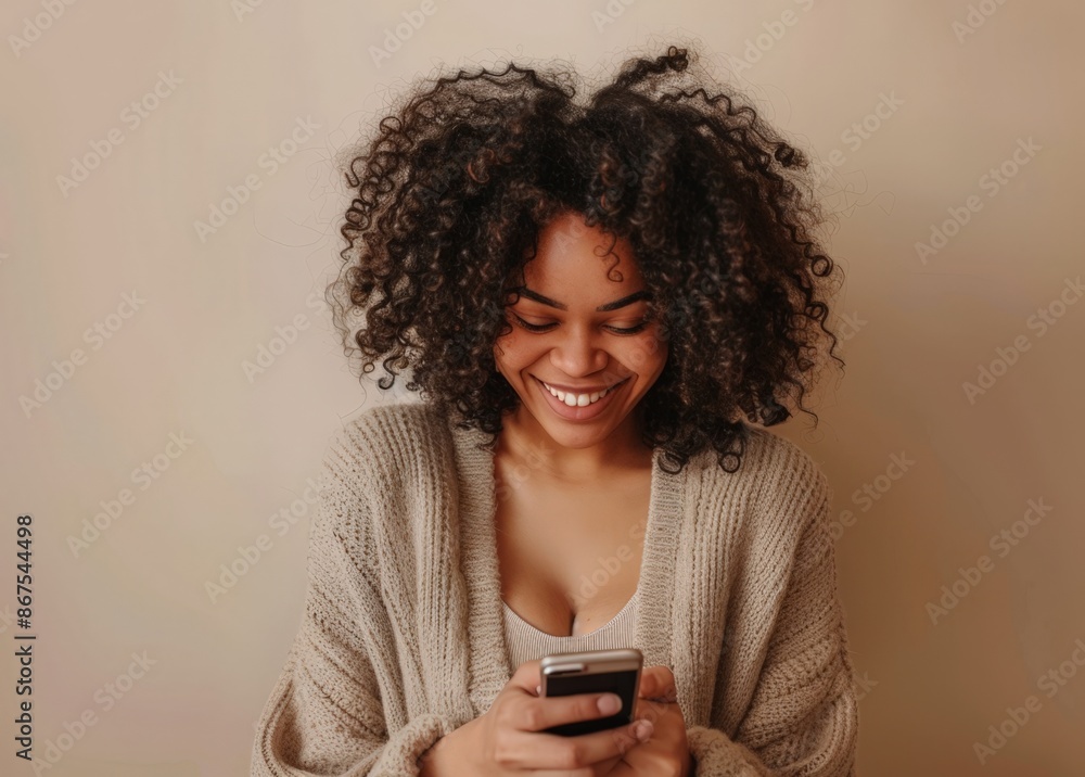 Smiling Woman with Curly Hair, Texting on Cell Phone Smiling Woman with Curly Hair, Texting on Cell Phone