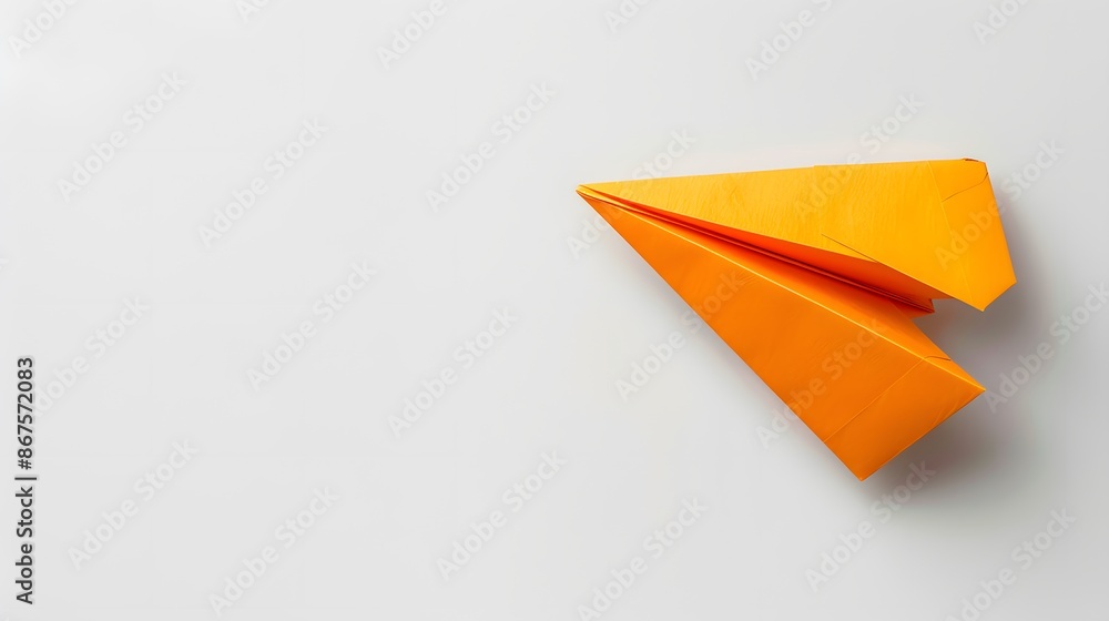 Orange Paper Airplane on a White Background Orange Paper Airplane on a White Background
