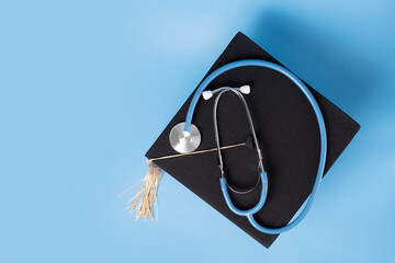 Medical education, graduation cap and doctor's stethoscope, student completing degree in medicine, college ceremony recognizing academic success