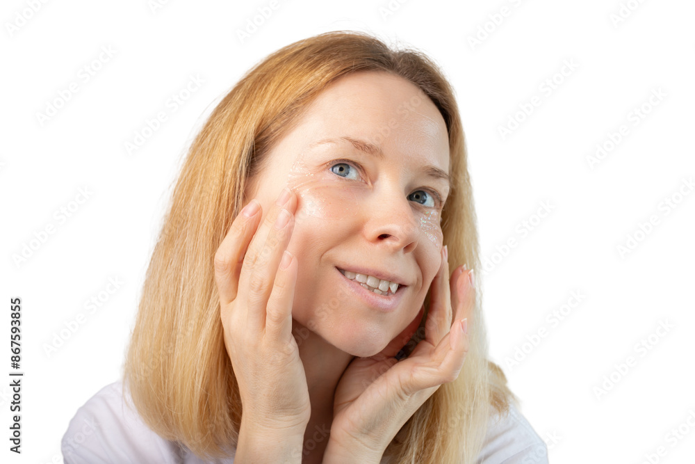 Woman putting eye patches on her face isolated on white background, collagen mask application, clean skin moisturizer, dermatology facial spa. Woman putting eye patches on her face isolated on white background, collagen mask application, clean skin moisturizer, dermatology facial spa.