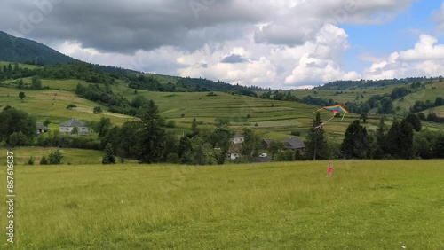 Wallpaper Mural little girl with colorful striped kite in Carpathian mountains, horizontal footage Torontodigital.ca