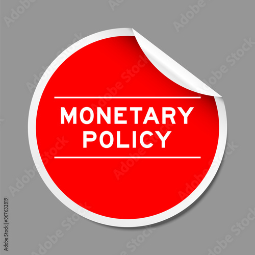Red color peel sticker label with word monetary policy on gray background