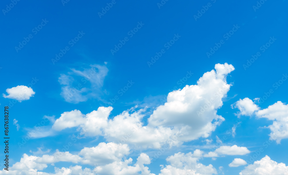 Blue sky with white fluffy clouds. Nature landscape. Cumulus cloud. Sunny summer day. Good weather. Cloudscape background. High quality Blue sky with white fluffy clouds. Nature landscape. Cumulus cloud. Sunny summer day. Good weather. Cloudscape background. High quality