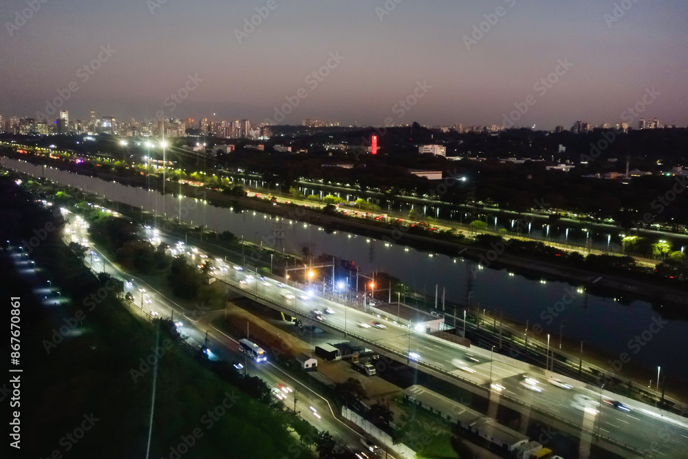 Sao Paulo, Brazil: cityscape at sunset. Pinheiros river, buildings and traffic Sao Paulo, Brazil: cityscape at sunset. Pinheiros river, buildings and traffic