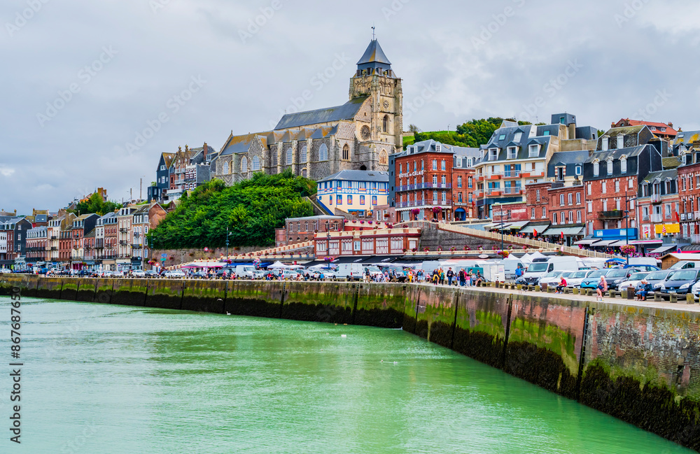 Fototapeta premium Impressive view of Le Treport at low tide, a traditional fishing village with colorful houses in Normandy, Northern France 