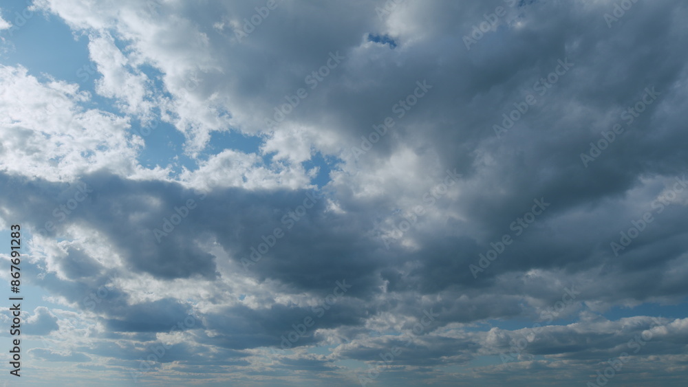 Obraz premium Beautiful blue sky with stratocumulus and clouds background. Sky with clouds weather nature cloud blue. Timelapse.