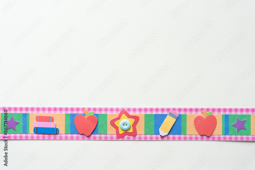scrapbooking embellishment border with primary school themes and a button on blank paper scrapbooking embellishment border with primary school themes and a button on blank paper
