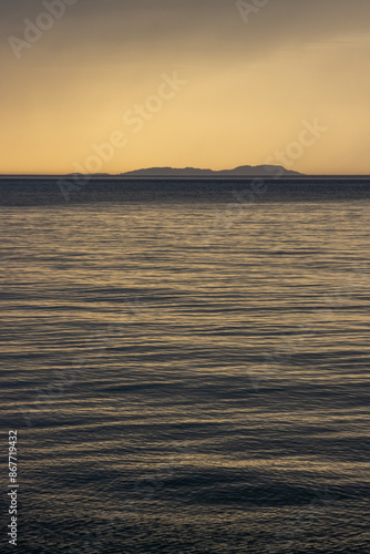 Calm sea and island Ereikousa, Greece photo