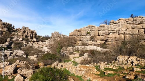 Hiking in the Torcal de Antequerra National Park, limestone rock formations and known for unusual karst landforms in Andalusia, Malaga, Spain.