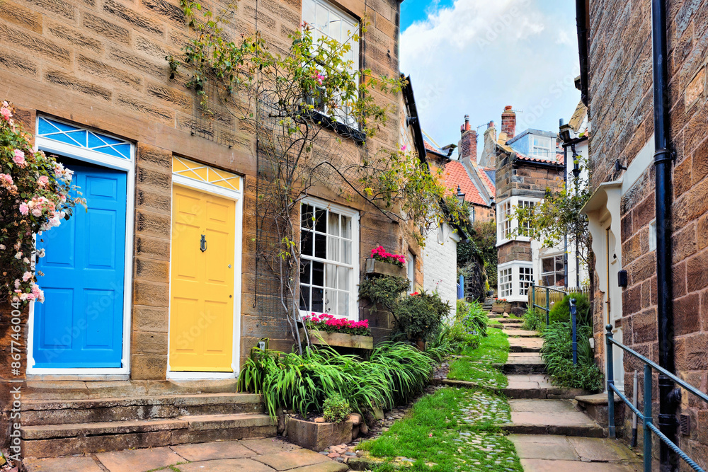 Naklejka premium Pretty cobblestone street in the old fishing village of Robin Hood's Bay, North Yorkshire, England