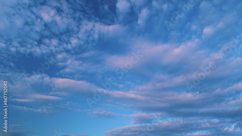 Cirrocumulus with ray light effects. Morning sunset blue sky with wispy smoke cirrocumulus. photo