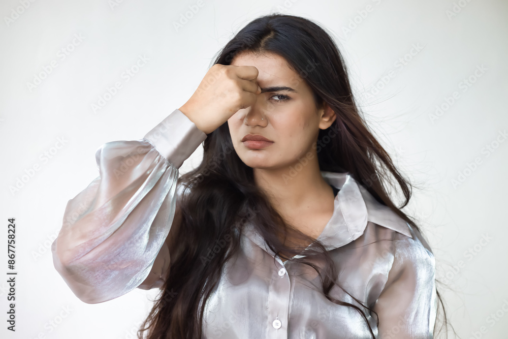 Indian woman suffering from migraine headache, stress, stressful lifestyle, vertigo, fatigue, overwork, mental fatigue, life problem Indian woman suffering from migraine headache, stress, stressful lifestyle, vertigo, fatigue, overwork, mental fatigue, life problem