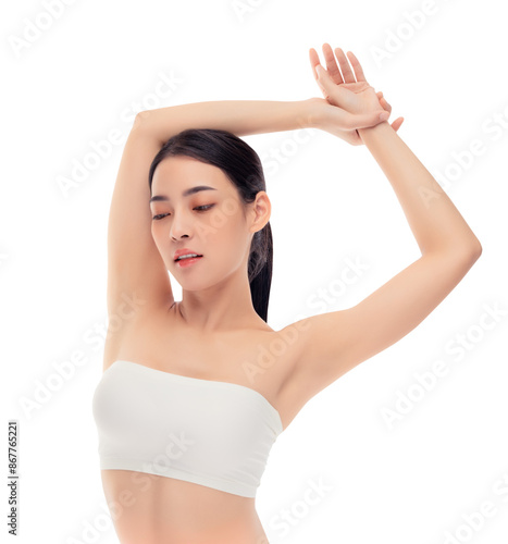 Young asia slim woman black hair and clear skin posing gracefully, arms raised and eyes closed, showcasing natural beauty and elegance against a white background. Ideal for beauty, skincare, wellness