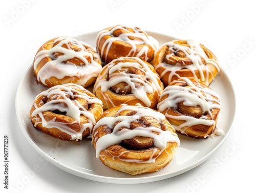 Cinnamon Rolls A plate of cinnamon rolls with icing drizzled on top