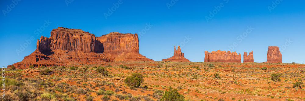 Monument valley in the late afternoon with clear skies Monument valley in the late afternoon with clear skies